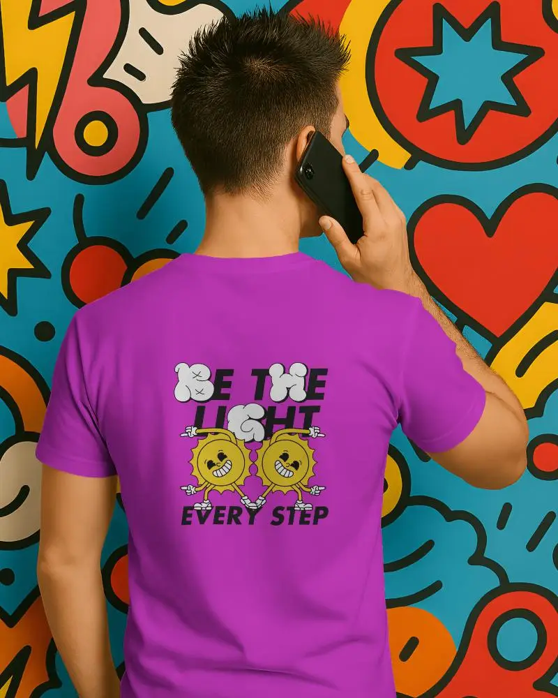 Casual Back Facing Tshirt Mockup Male Model Talking On Phone With Cartoon Heart Stars Pattern Wall