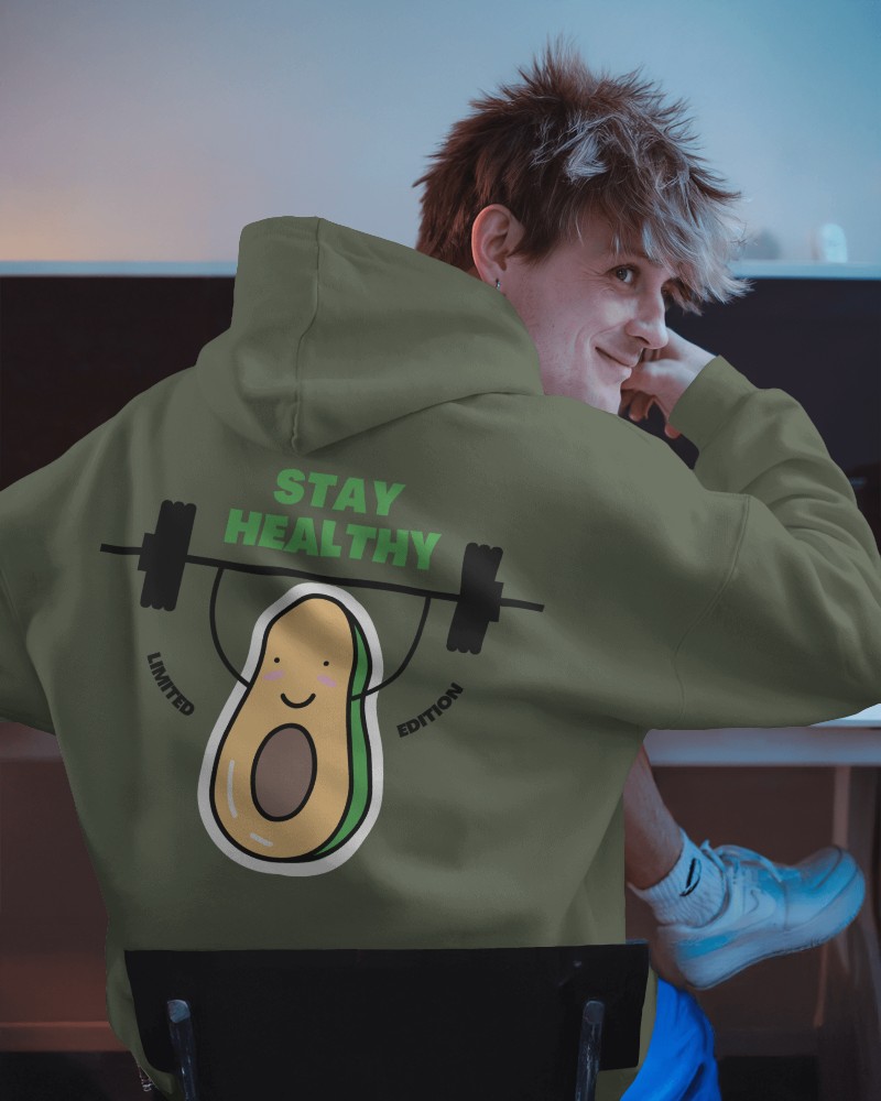 Gym Inspired Hoodie Mockup Young Model In Dimly Lit Creative Environment