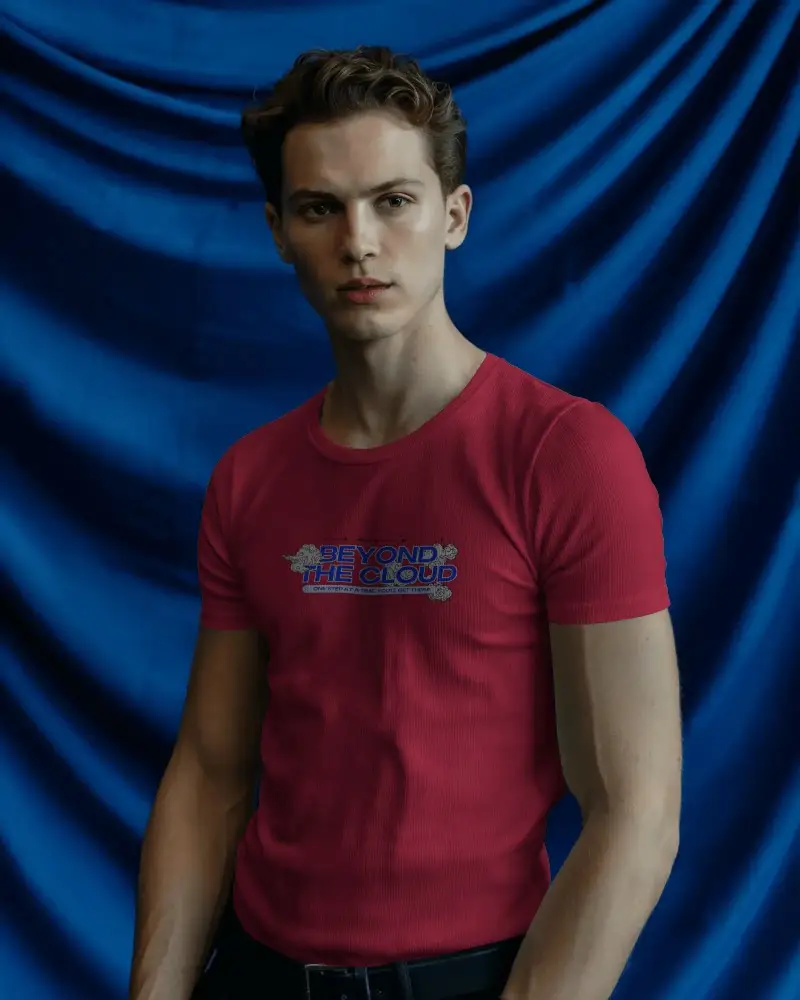 Bold Backdrop T Shirt Mockup Male Model In Front Of Deep Blue Draped Fabric Studio Fashion
