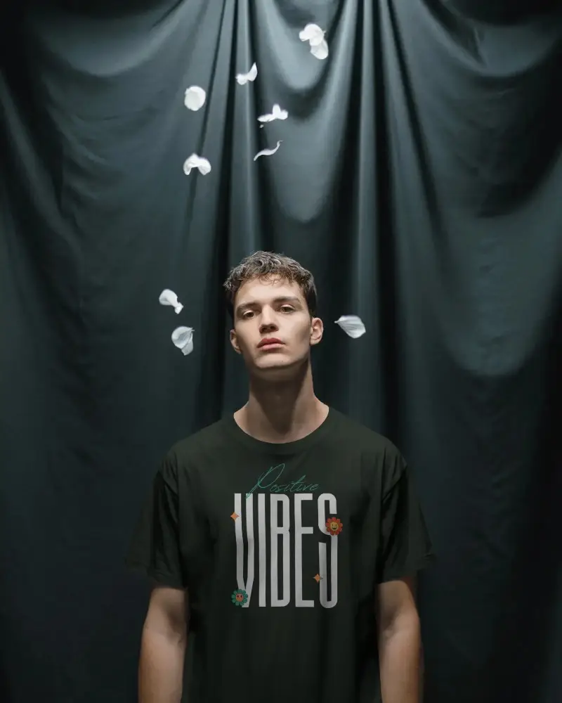 Creative T Shirt Mockup Male Model Under Falling Petals Dramatic Studio Editorial Look