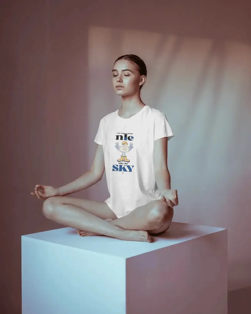 T Shirt Mockup Female Model Sitting In Meditation Pose Soft Studio Lighting Calm Ambience