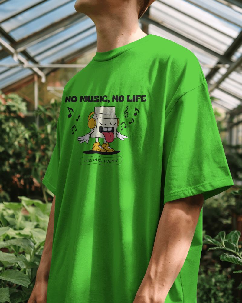 Sunlit Greenhouse Blank Round Neck T Shirt Mockup Man In Light Gray Oversized Tee Natural Light And Lush Greenery 0827