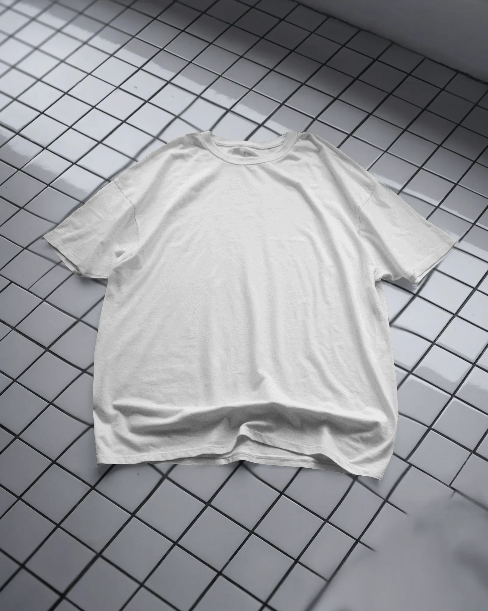 Top Down Boxy White T Shirt Mockup Oversized Fit Laid Flat On Tiled Surface