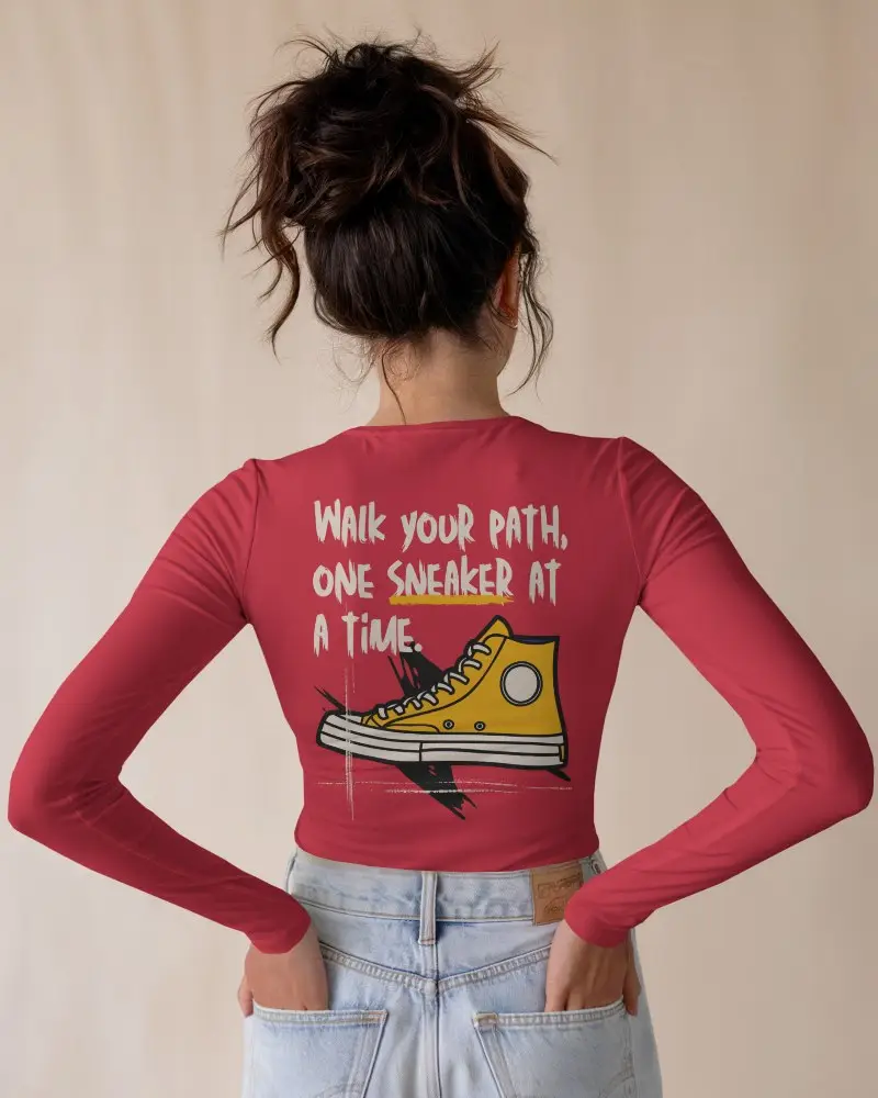 White Long Sleeve Back Print Mockup Female Model In High Waisted Jeans Hands On Hips Neutral Background