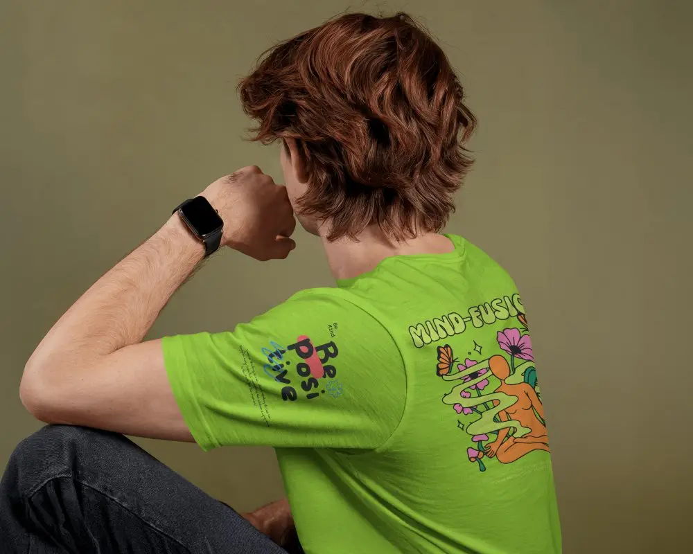 Seated Backview Tshirt Mockup Male Model With Wavy Hair And Smartwatch