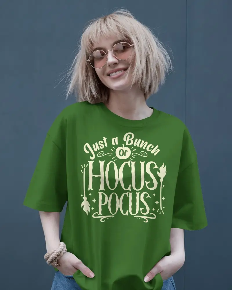 Stylish Woman Showcasing T Shirt Against A Sophisticated Blue Wall