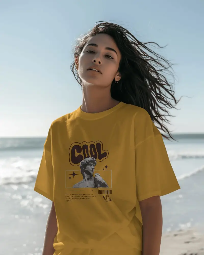 Sunlit Beachside Tshirt Mockup Female Model With Windblown Hair Gazing Ahead Relaxed Vibe With Soft Natural Light And Ocean Backdrop 01245