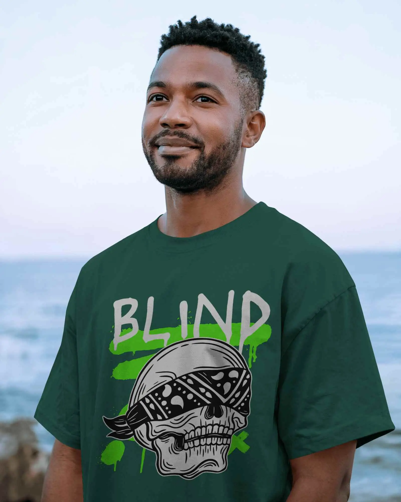 Outdoor T Shirt Mockup Smiling Male Model In Grey Tee Facing Camera With Ocean Horizon And Natural Light