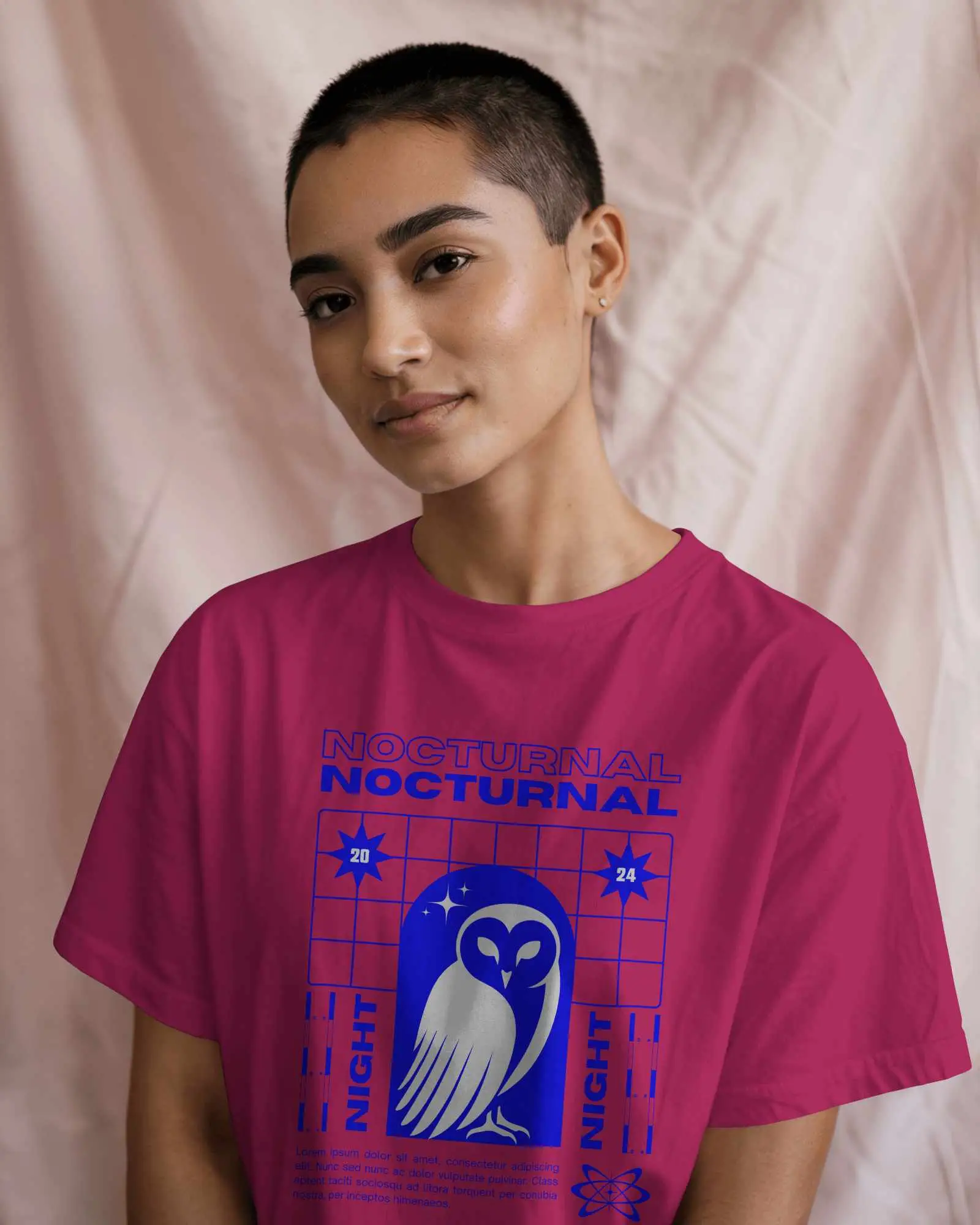 Indoor T Shirt Mockup Female Model With Buzzcut Wearing White Tee Soft Lighting And Pink Fabric Backdrop