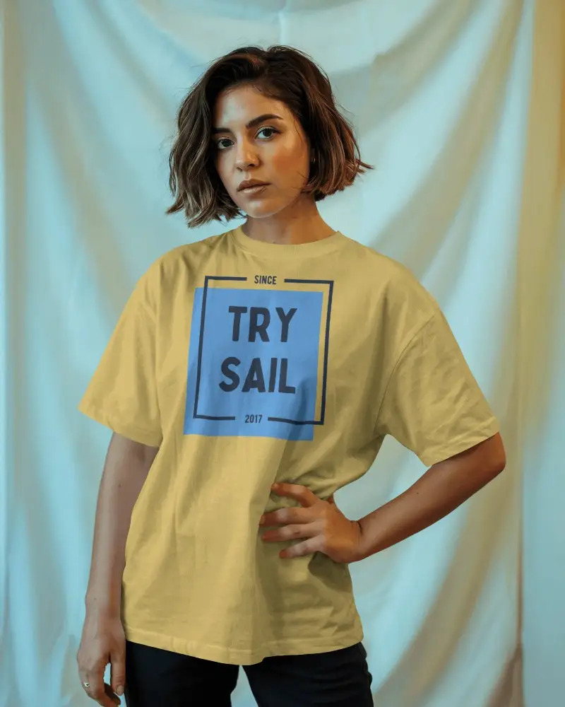 Fashion Forward Tshirt Mockup On Woman In Studio Setting With Soft Curtain Background And Bold Expression