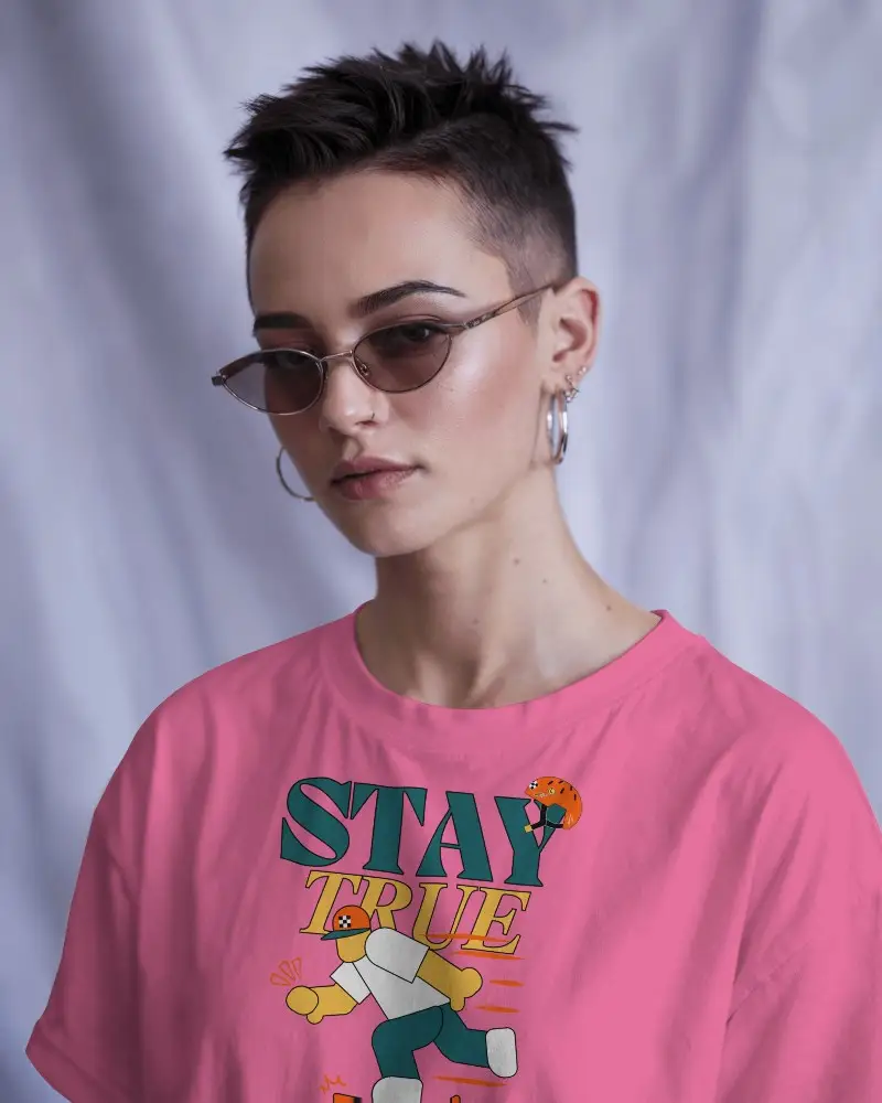 White Crew Neck T Shirt Mockup Front Angle View On Person With Textured Pixie Cut Slim Sunglasses And Stacked Hoop Earrings Soft Purple Draped Backdrop Modern And Stylish Vibe