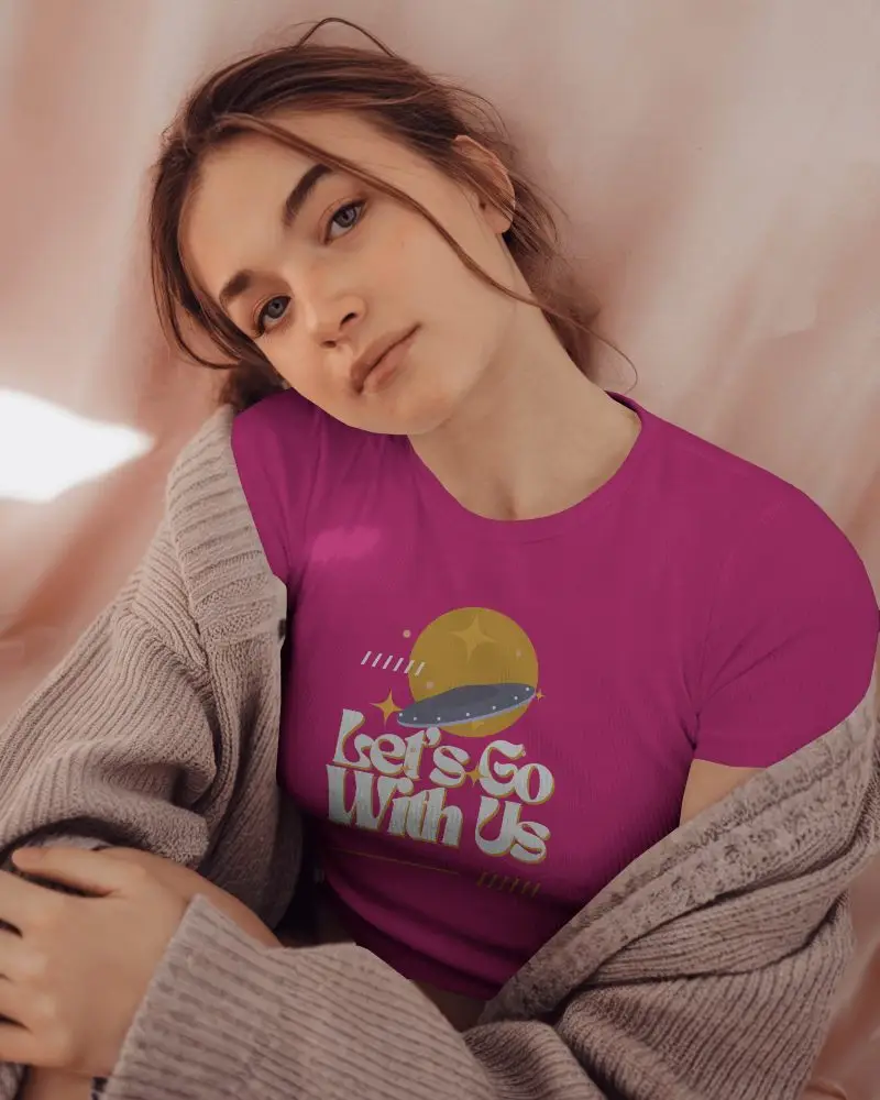 Cozy Tshirt Mockup Female Model Reclining Against Soft Pink Fabric In Knit Cardigan Relaxed Intimate Lighting And Warm Vibe