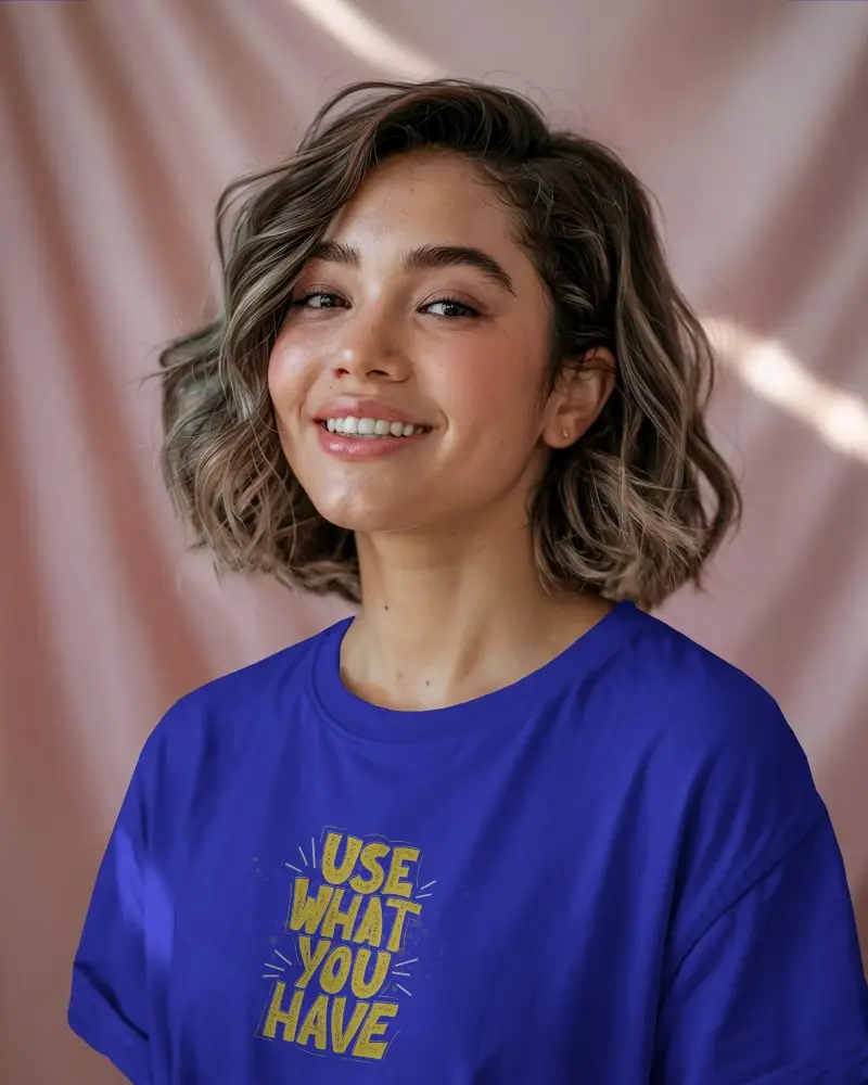 Pastel Curtain Backdrop Tshirt Mockup Smiling Female Model In Soft Lighting Wearing White Shirt Great For Calm And Feminine Branding