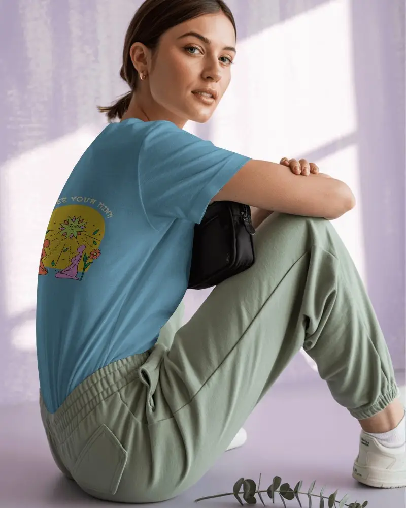 Natural Light Back Print Tshirt Mockup Woman In Green Joggers And White Sneakers Relaxed And Modern Aesthetic