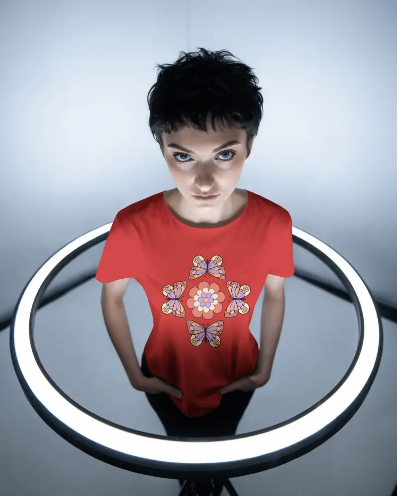 Futuristic Studio T Shirt Mockup Female Model Under Glow Ring Light Top View Intense Expression Modern Editing