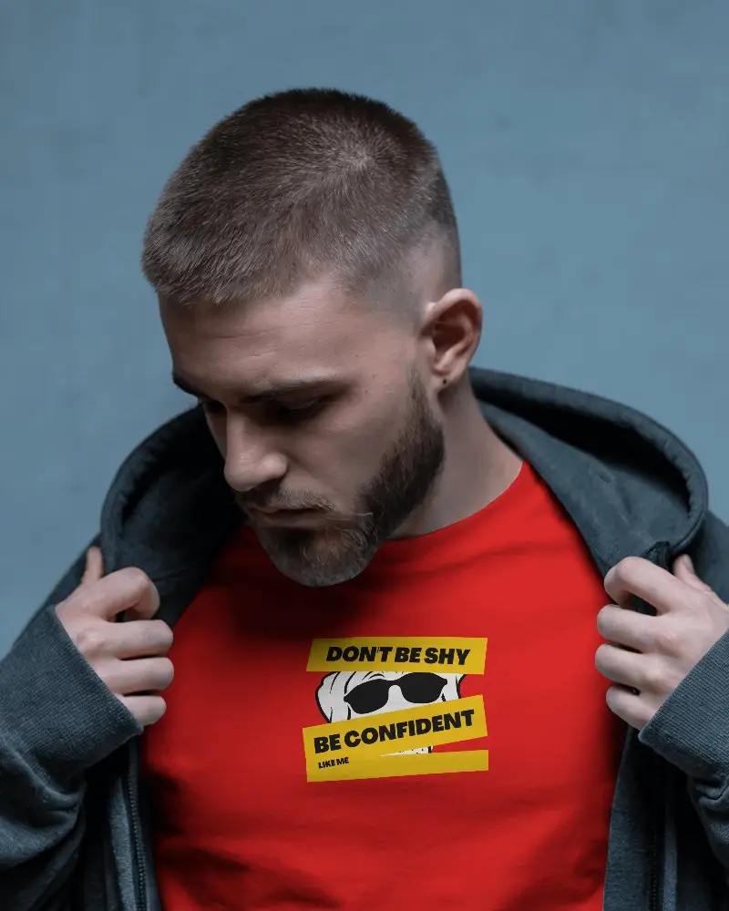 Streetwear Tshirt Mockup Male Model Unzipping Hoodie To Reveal Custom Design In Studio Setting