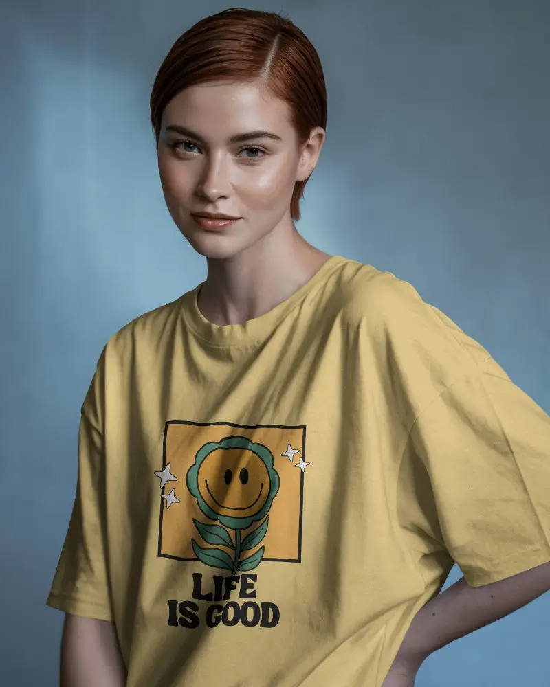 Editorial Style Tshirt Mockup Female Model In Loose Fit Oversized Tee Soft Blue Studio Background Clean And Confident Look