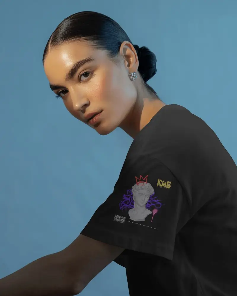 Elegant Studio Tshirt Mockup Female Model In Side Pose On Blue Backdrop Soft Lighting High Fashion Look