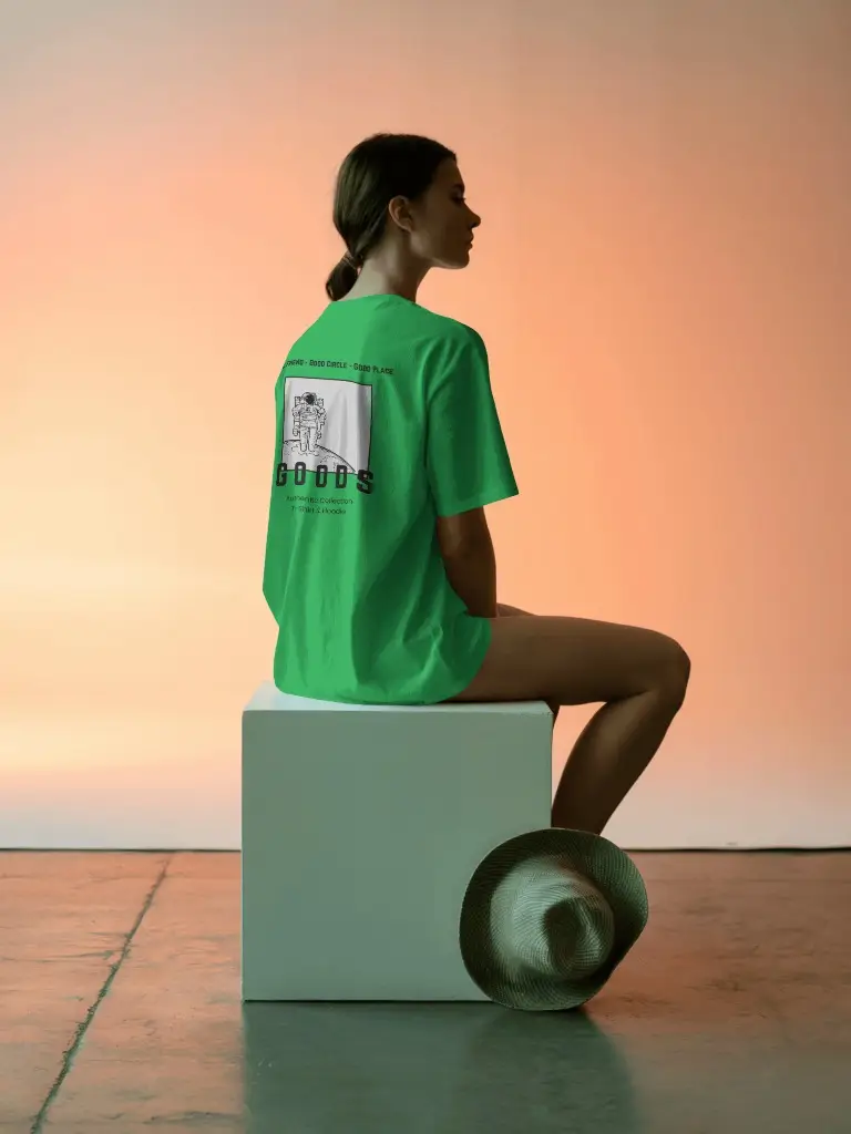 Back View Tshirt Mockup Female Model Sitting On White Block In Sunset Light With Hat On Floor Soft Shadow Scene