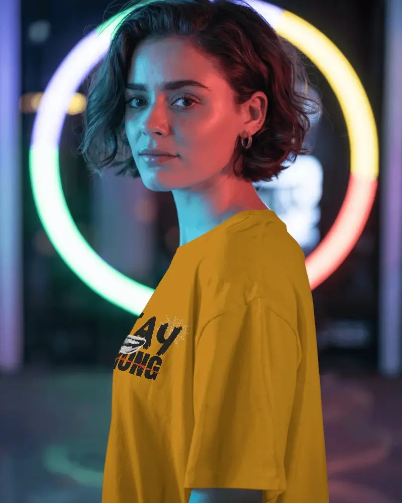 Vibrant Neon Lit T Shirt Mockup With Female Model In Urban Night Scene Perfect For Edgy Streetwear Branding