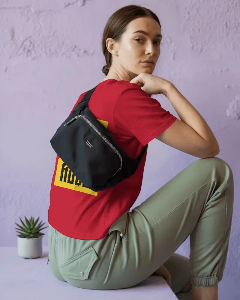 Casual Outfit Tshirt Mockup Featuring Back Design Hidden Under Sling Bag On Young Female Model Against Pastel Wall