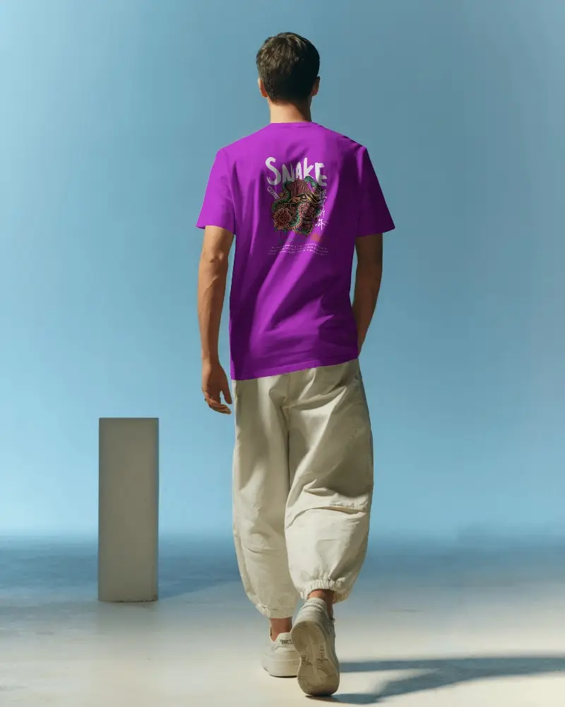 Back View Tshirt Mockup With Male Model Walking In Minimalist Pastel Studio Setting