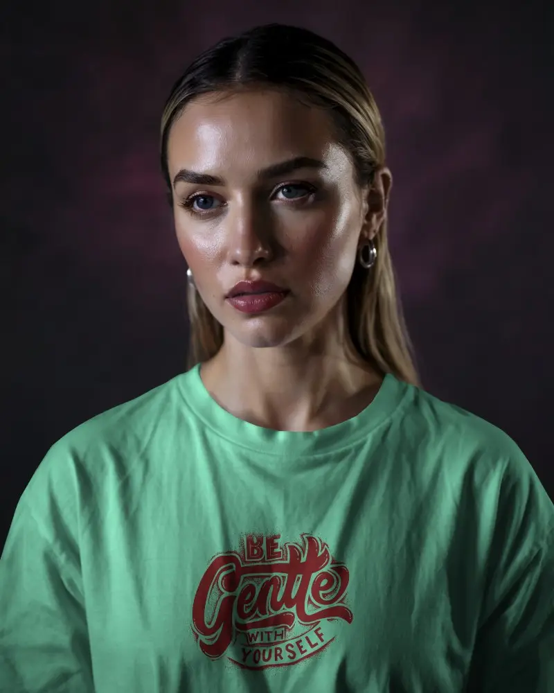 White Tshirt Mockup Female Model Front View Moody Dark Background Soft Lighting High Fashion Expression Bold Eye Makeup