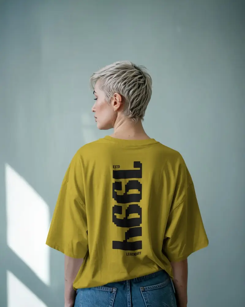 Sunlit Blue Wall T Shirt Mockup Female Model With Platinum Blonde Pixie Cut In Natural Light Casual Minimal Aesthetic