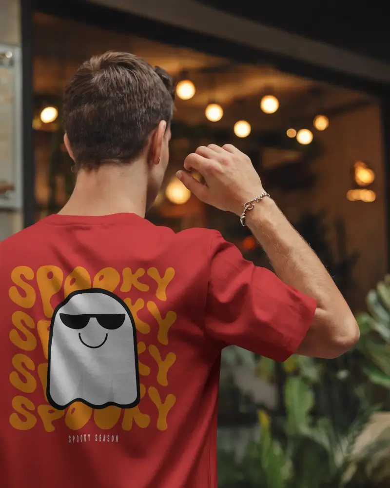 Night Lit Outdoor Tshirt Mockup Male Model Raising Hand In Front Of Cozy Urban Cafe Fiery Bokeh Background