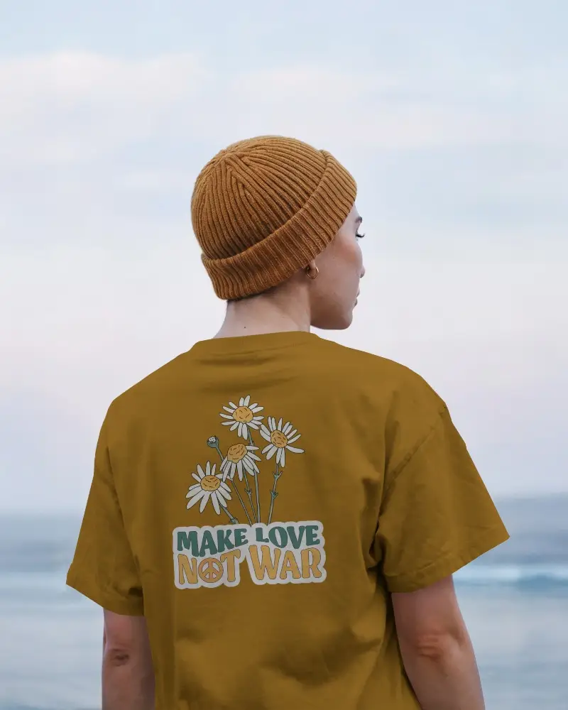 Tshirt Mockup Coastal Backdrop Person Wearing Beanie Facing Ocean In Soft Morning Light Relaxed And Serene Vibe