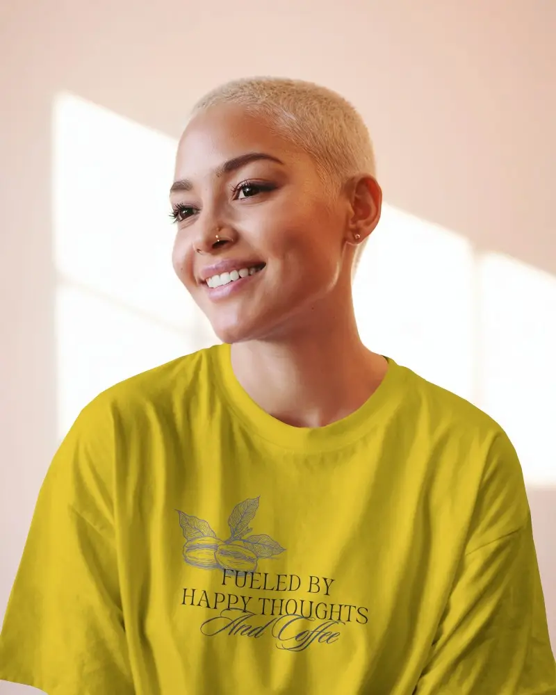 Sunlit Interior Tshirt Mockup Female Model Smiling In Soft Pink Light With Blonde Buzzcut Relaxed Casual Style