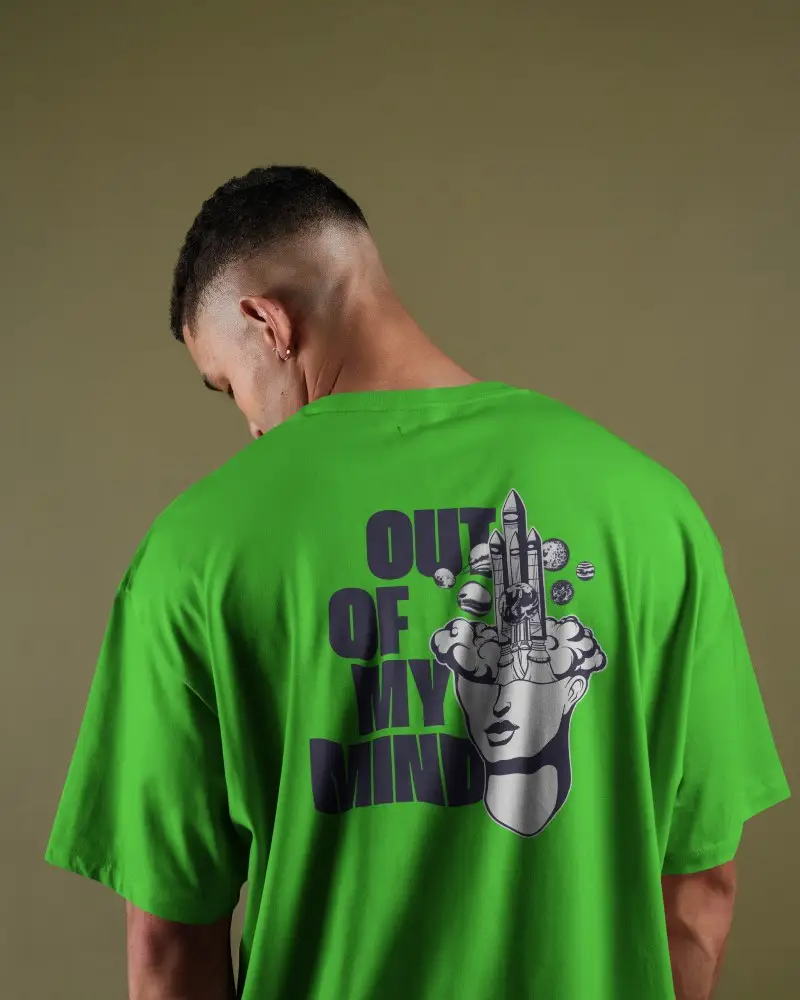 Studio Lit Tshirt Mockup Male Model With Fade Haircut Facing Away Minimal Green Background Casual Fit Display