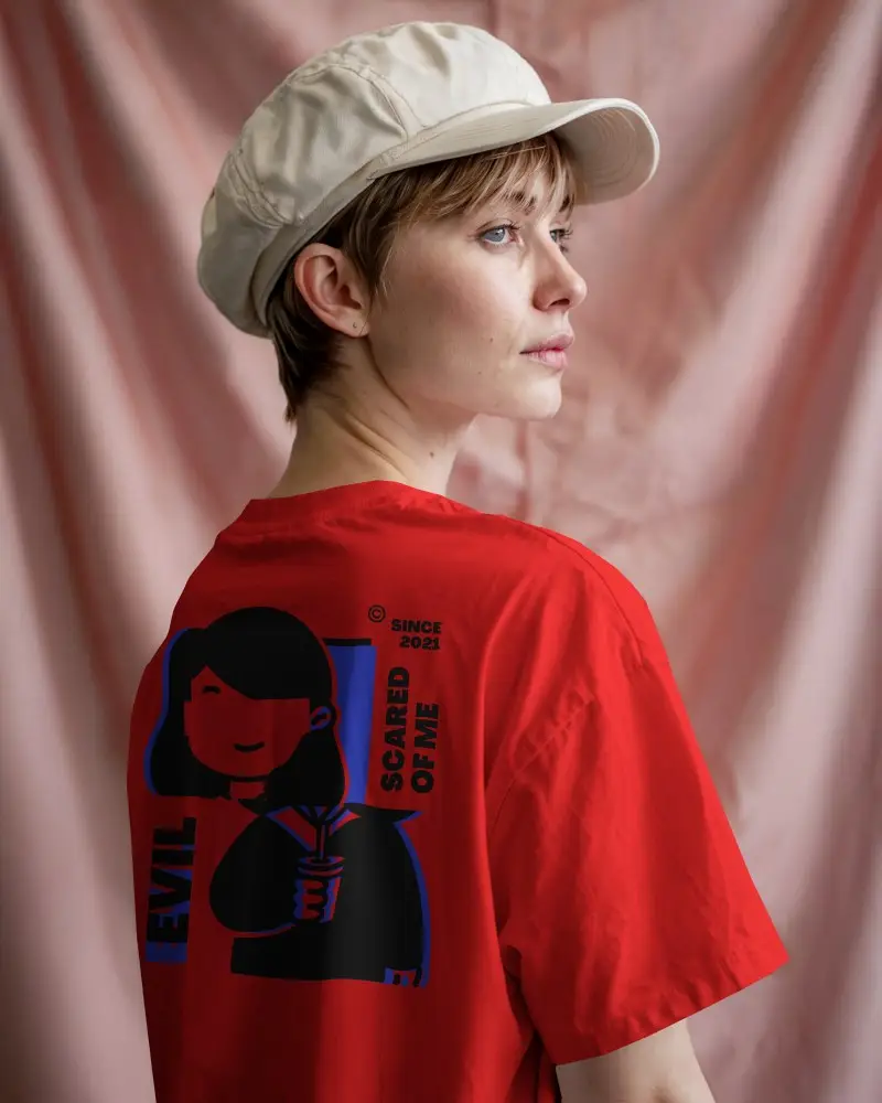 Studio Tshirt Mockup Female Model In White Cap Facing Side Pink Drape Backdrop Soft Lighting