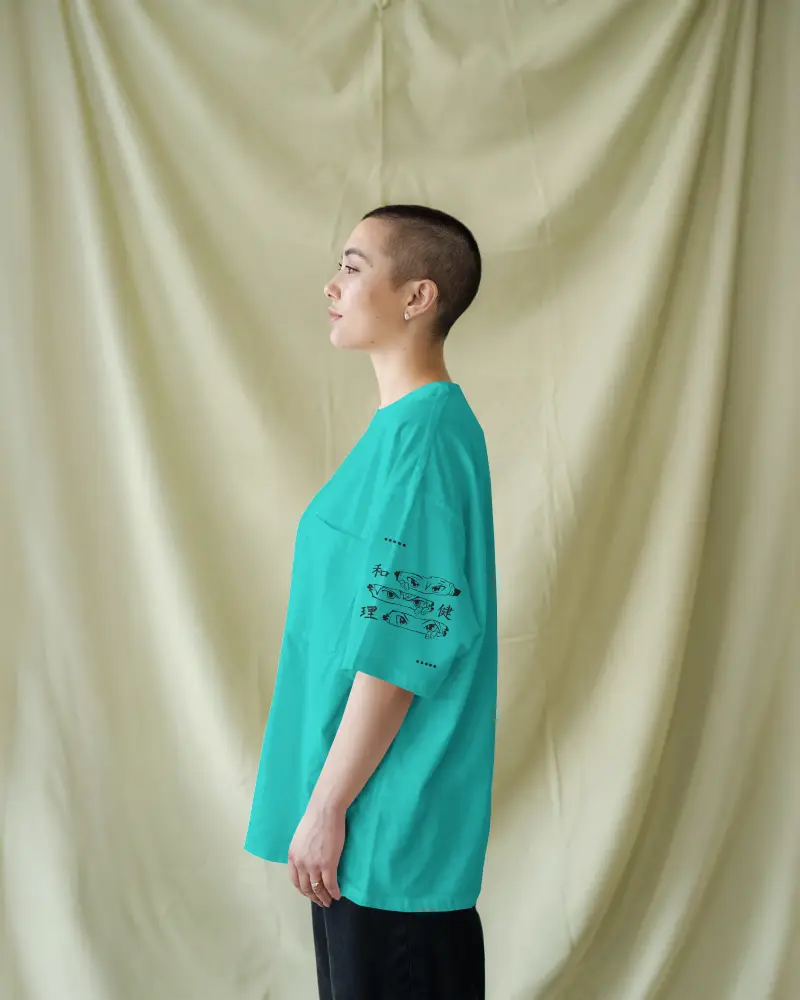 Studio Tshirt Mockup Sideview Woman In White Tee Buzzcut Soft Cream Drape Backdrop Sleeve Focus