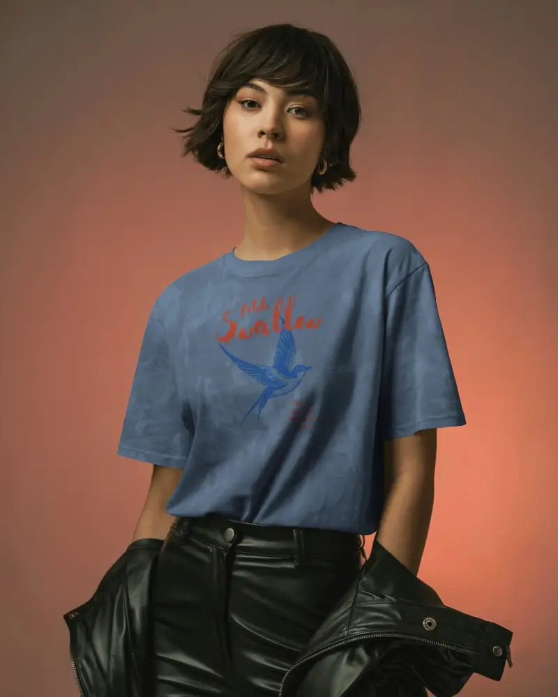 Editorial Style T Shirt Mockup Confident Woman Posing With Jacket Under Arm In Moody Lighting