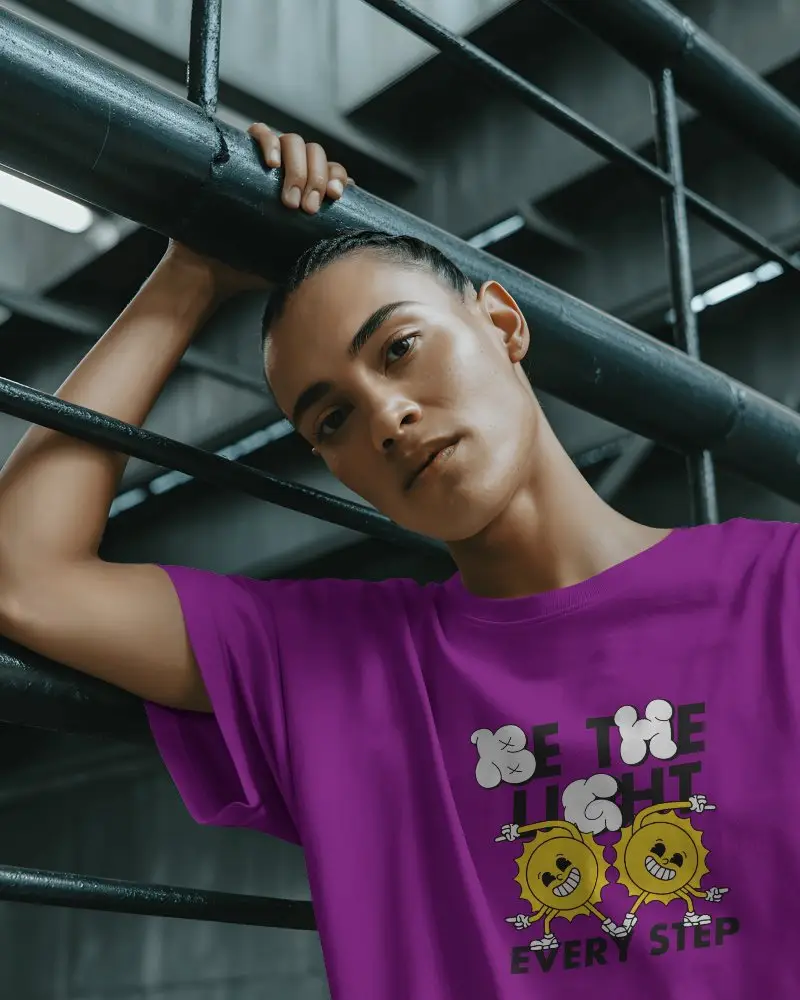Urban Industrial T Shirt Mockup Model Posing Against Metal Railings In Moody City Setting