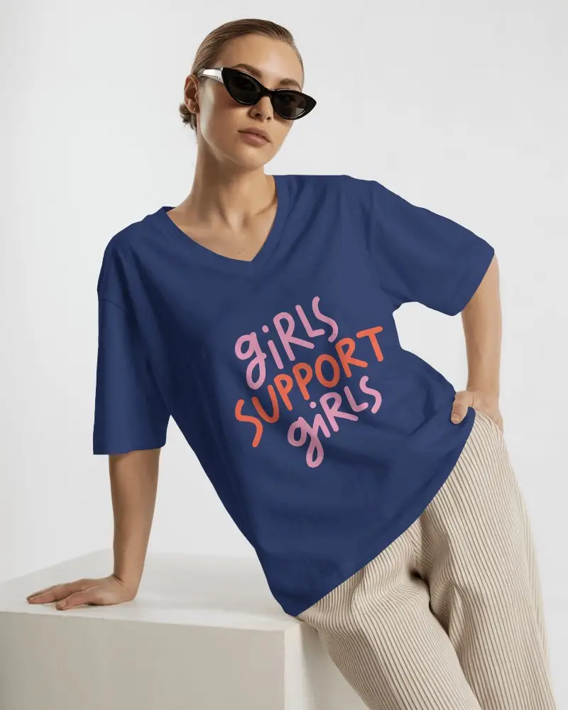 Fashion Forward V Neck T Shirt Mockup Female Model In Sunglasses And Pleated Pants On White Studio Backdrop