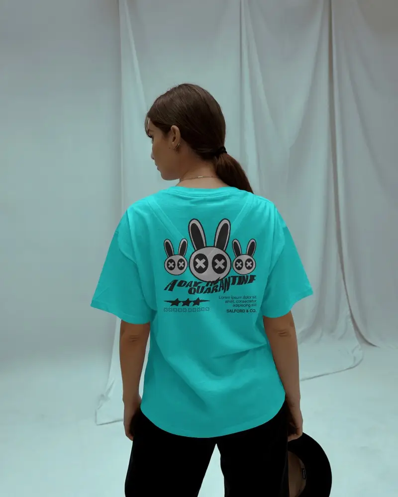 Minimal Studio T Shirt Mockup Female Model Facing Back In Loose Fit Shirt With Curtains