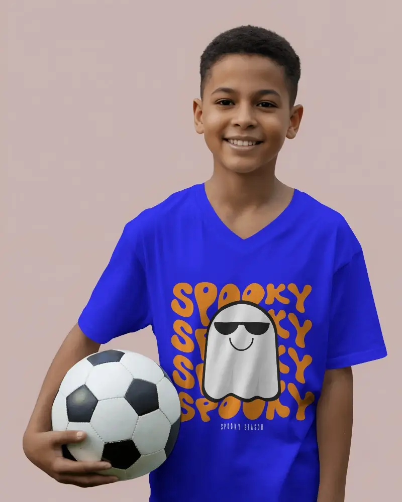 Smiling Boy Wearing V Neck T Shirt Mockup Holding Soccer Ball Against Muted Pink Backdrop