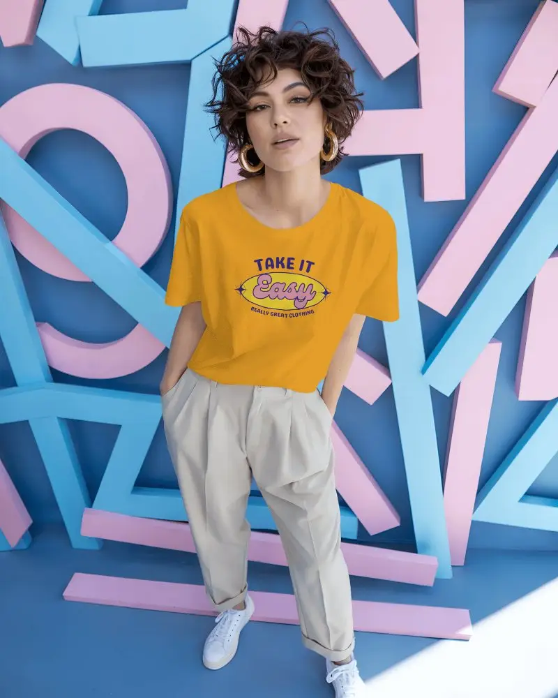 T Shirt Mockup Confident Woman Posing Against Colorful Geometric Pastel Blue Wall Art