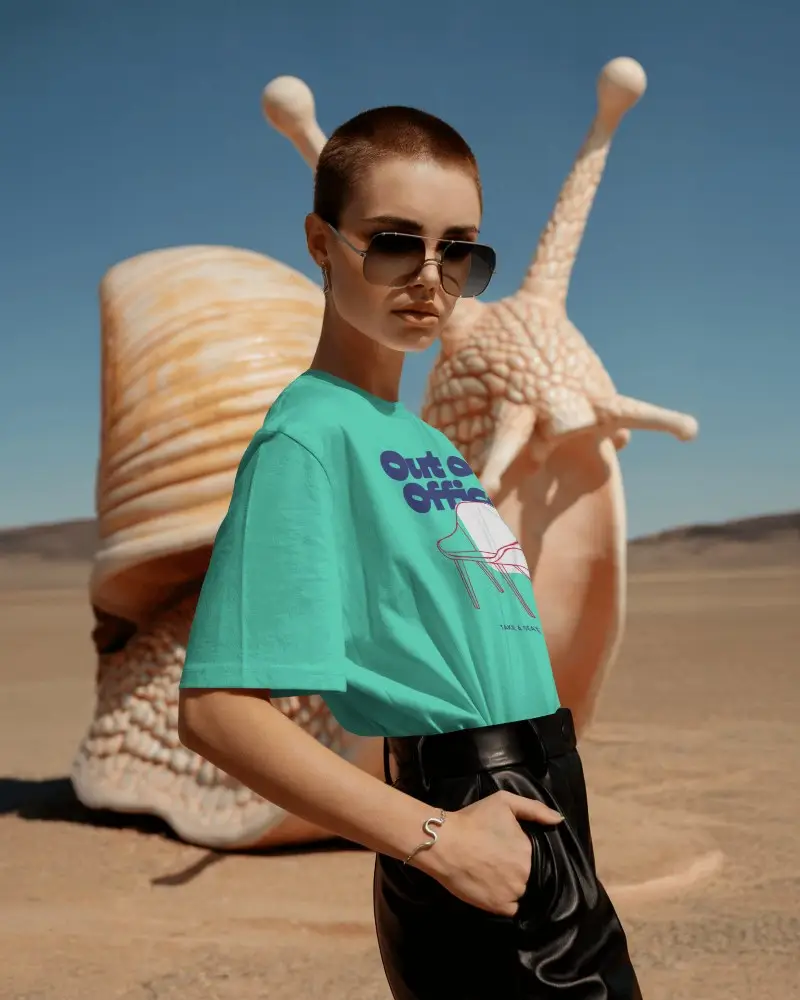 Avant Garde Look T Shirt Mockup Strong Pose In Surreal Artscape With Giant Snail