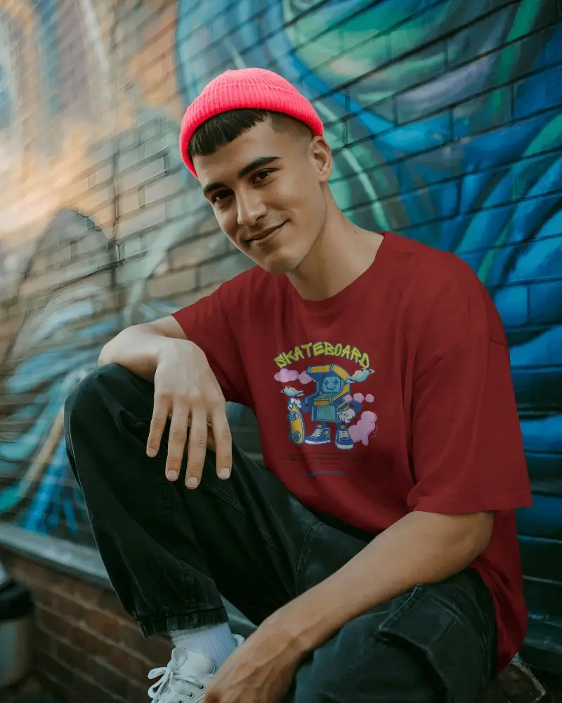 Urban Streetwear Tshirt Mockup Man In Pink Beanie Sitting Against Graffiti Wall