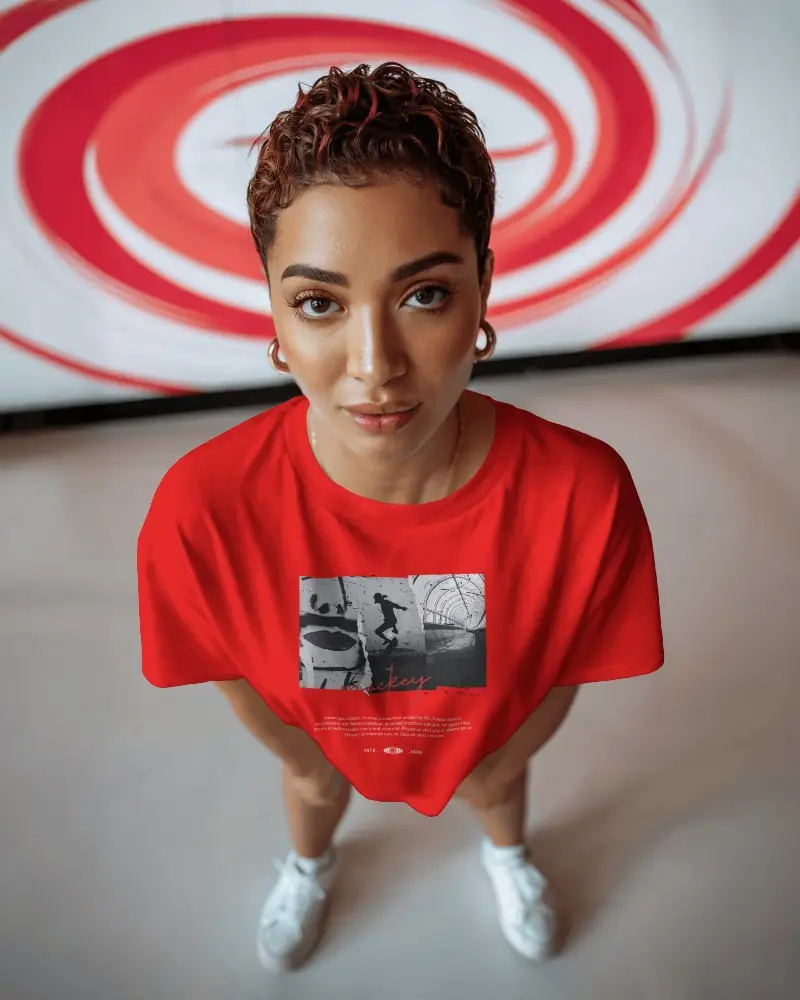 Urban Pop Style Tshirt Mockup High View Female Model In Artistic Surrounding Space