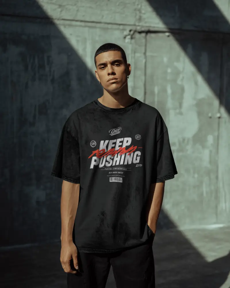 Urban Streetwear Tshirt Mockup On Male Model In Industrial Setting With Sharp Light And Shadow