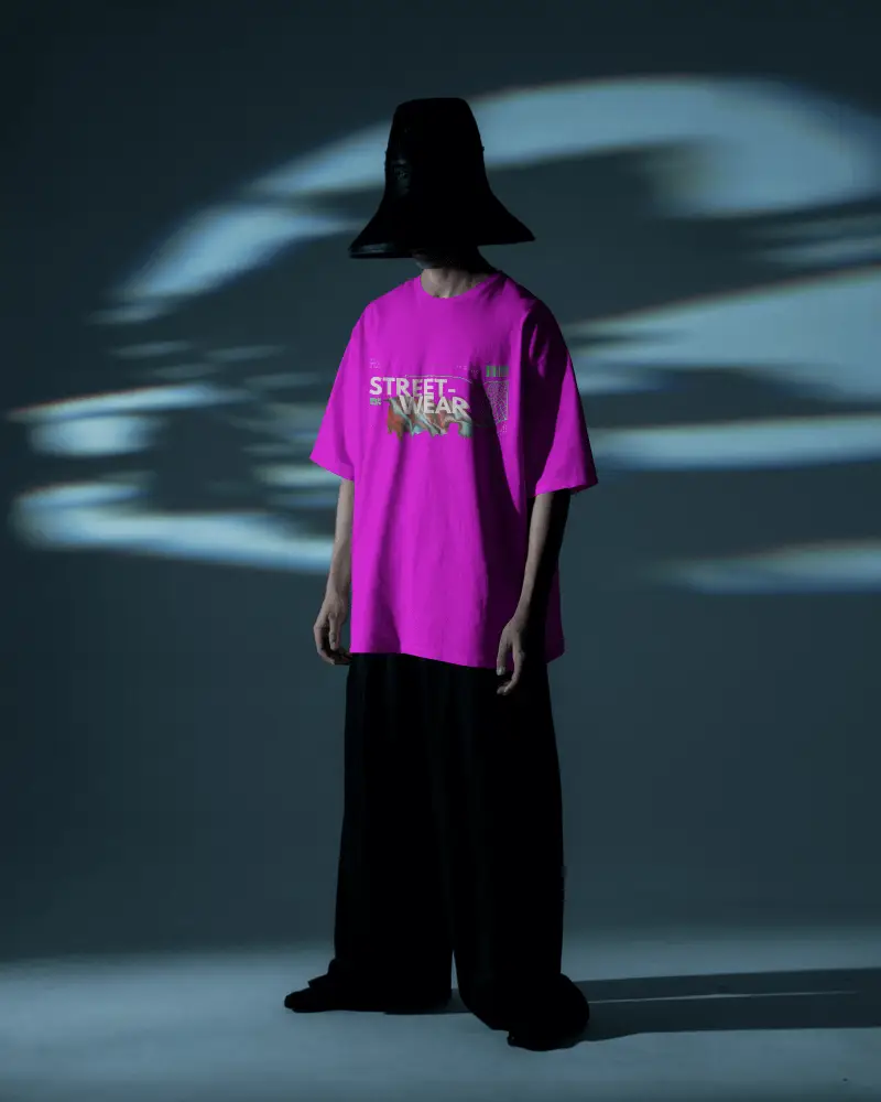 Vant Garde Darkroom Tshirt Mockup Male Model With Wide Pants And Oversized Hat Moody Lighting
