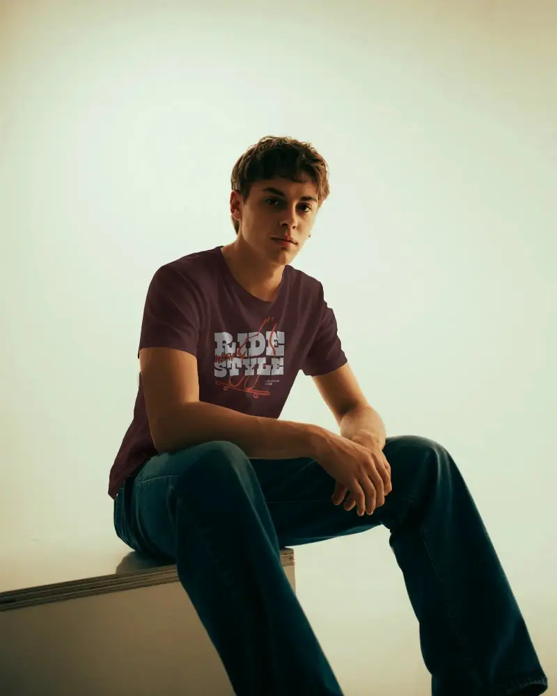 Trendy Minimalist T Shirt Mockup For Male Model Studio Seated Fashion Portrait