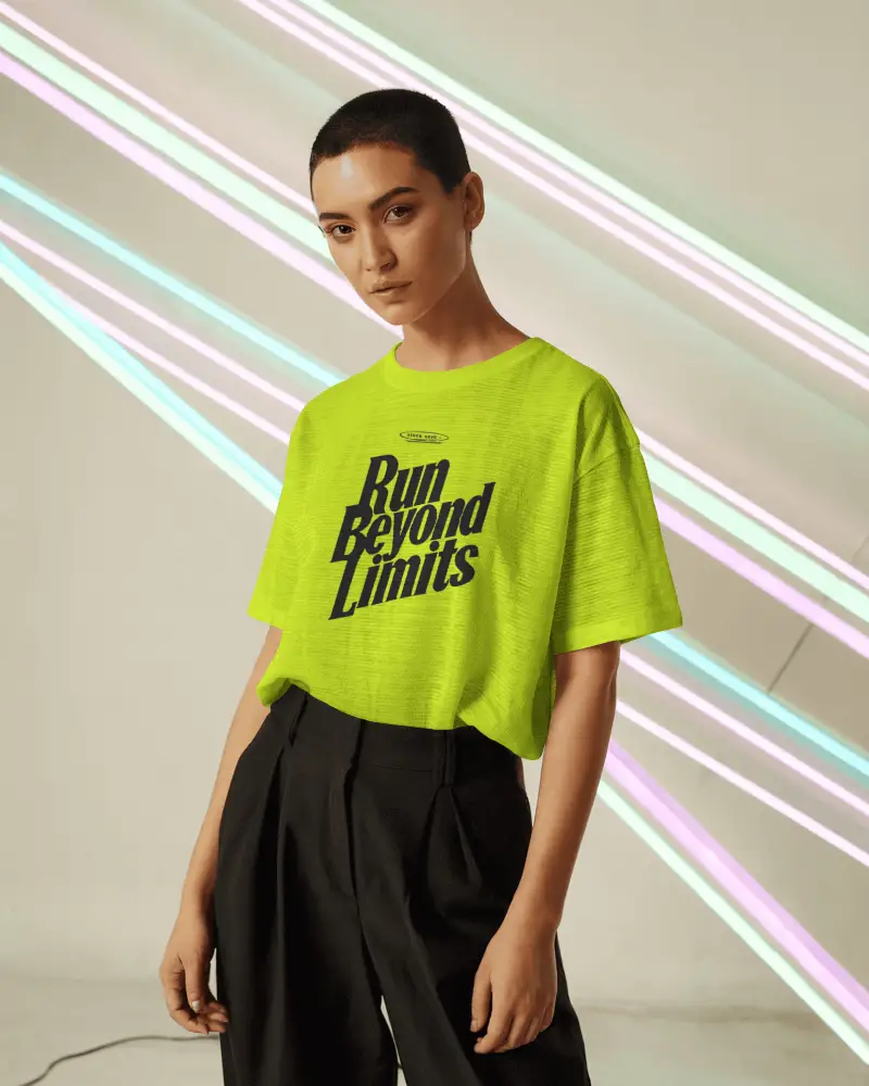 Neon Backdrop Tshirt Mockup Female Model Short Hair Bold Style Modern Futuristic Editorial