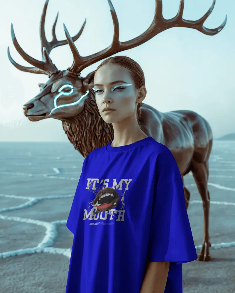 Surreal Tshirt Mockup Female Model With Metallic Deer Statue In Desert Landscape Scene