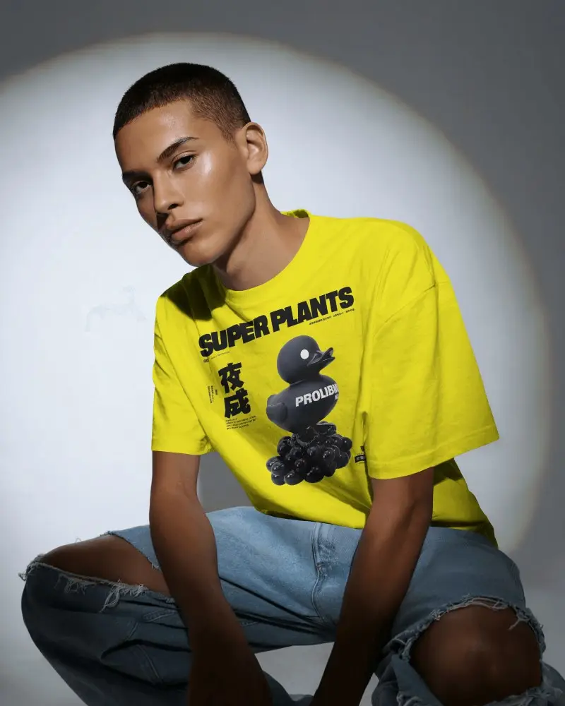 Urban Studio T Shirt Mockup Male Model Sitting Under Spotlight Modern Casual Look