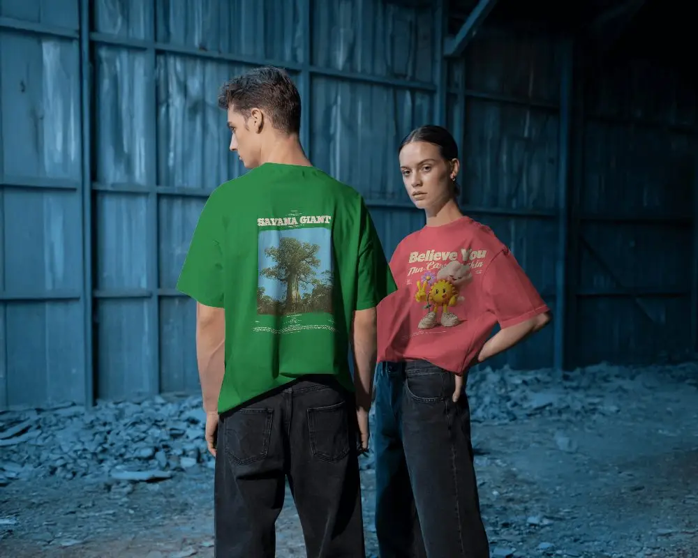 Moody Industrial Tshirt Mockup Male And Female Models In Blue Toned Warehouse Setting